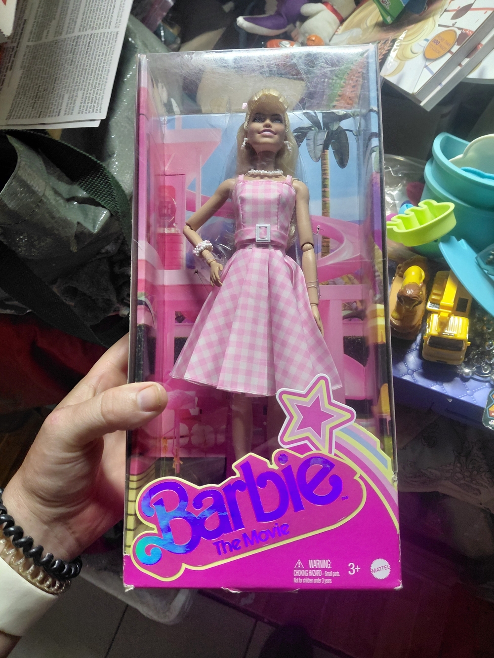 the collectible Barbie The Movie doll featuring Margot Robbie wearing her iconic